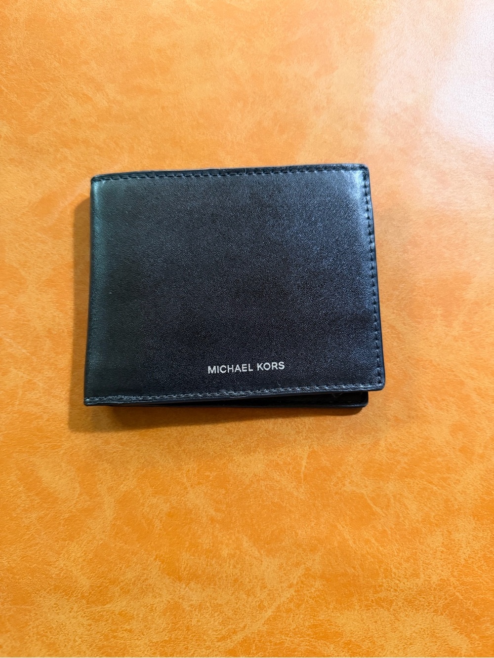 Michael Kors Black Leather Men's Bi-Fold Wallet with Silver Logo